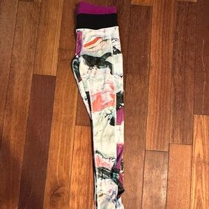 Multicolored LuLuLemon leggings with back zip pocket.